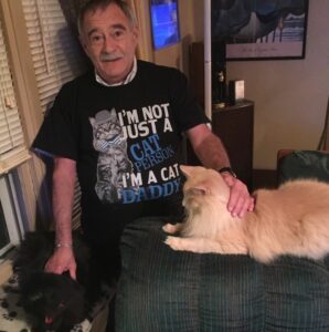 Elder white man with his two cats