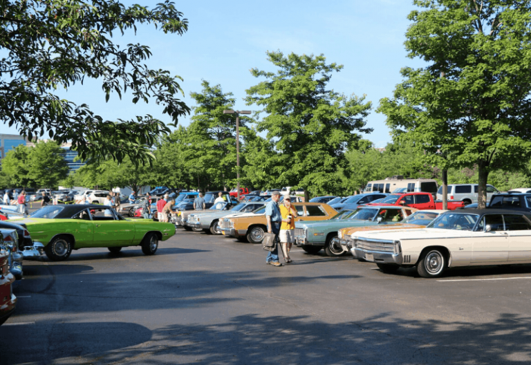 cars lined up at a lambda car club exhibition