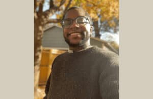 Focus Editor Jasper Joyner smiles outside