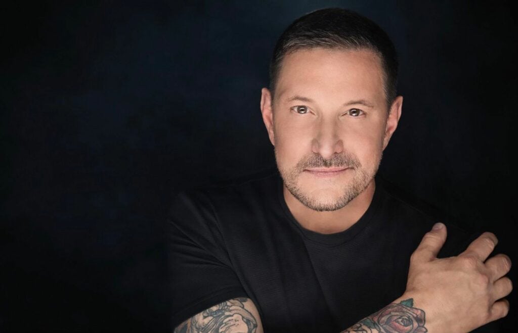 Ty Herndon in front of a black background