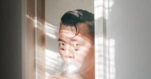 Close up of Tommy Kha self portrait with white background