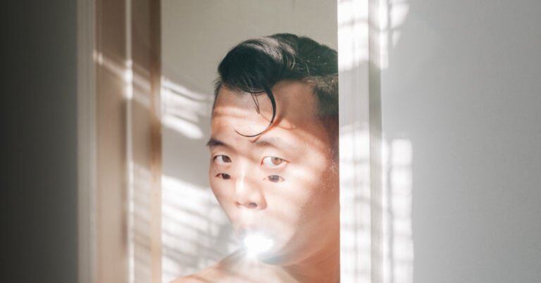 Close up of Tommy Kha self portrait with white background