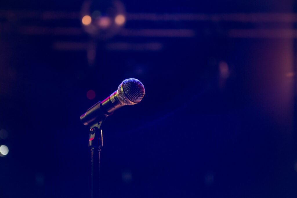 Secret Valentine’s Day Comedy Show, image of microphone on stage via Unsplash