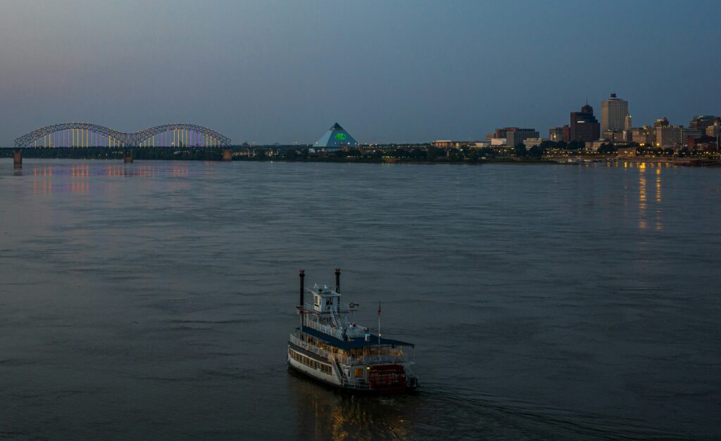 Valentine’s Day Memphis Riverboat Cruises, image of riverboat on water via Terrence Raper/Unsplash