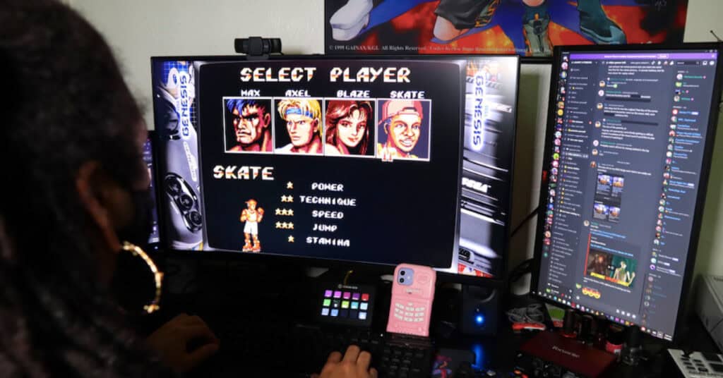 Lo Norman faces a screen showing the video game Rage