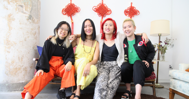Four asian femmes sitting side by side on a decorative orange couch. MengCheng 梦城团 Collective: An Invitation to Be.
