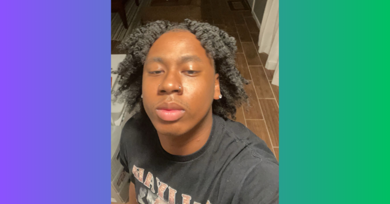 Selfie of nonbinary Black person with long natural hair