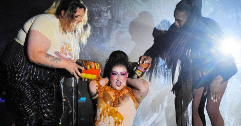 Image of drag performer Zoloft having beans poured all over them