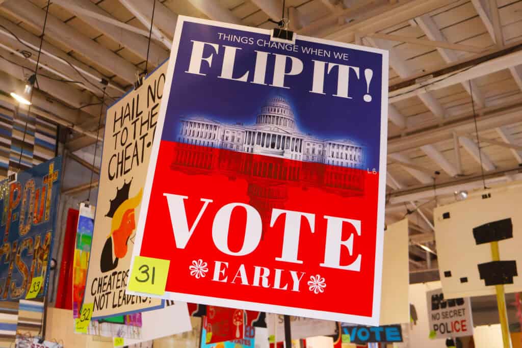 A political poster urging early voting with the Capitol building in the background. — focuslgbt.com