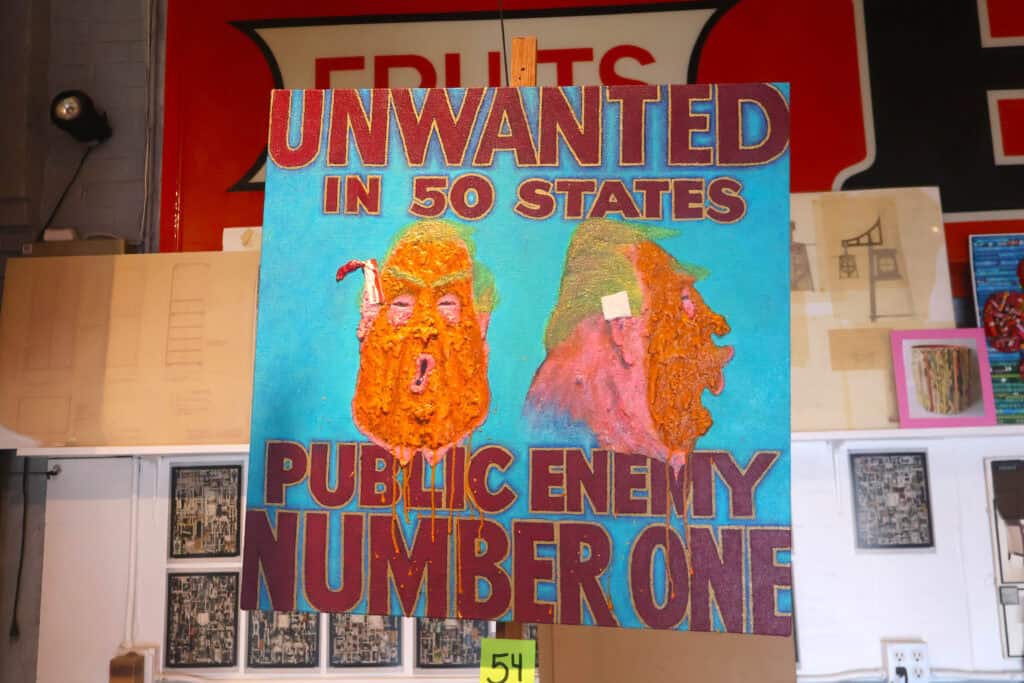 Colorful poster with two bearded faces labeled 'Unwanted in 50 States' and 'Public Enemy Number One'. — focuslgbt.com