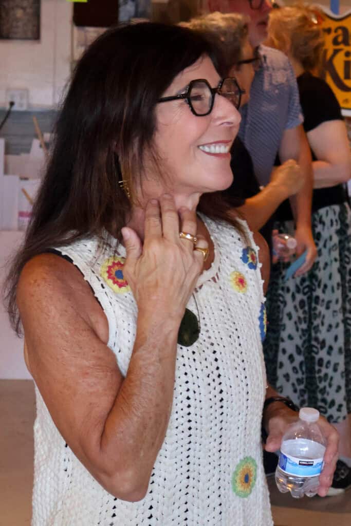 Woman with dark hair and glasses smiling at a social event in Memphis. — focuslgbt.com