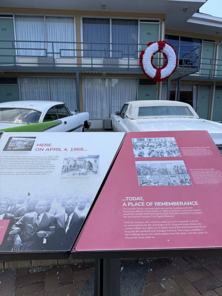 Historical exhibit panels and vintage cars at the Civil Rights Museum. — focuslgbt.com