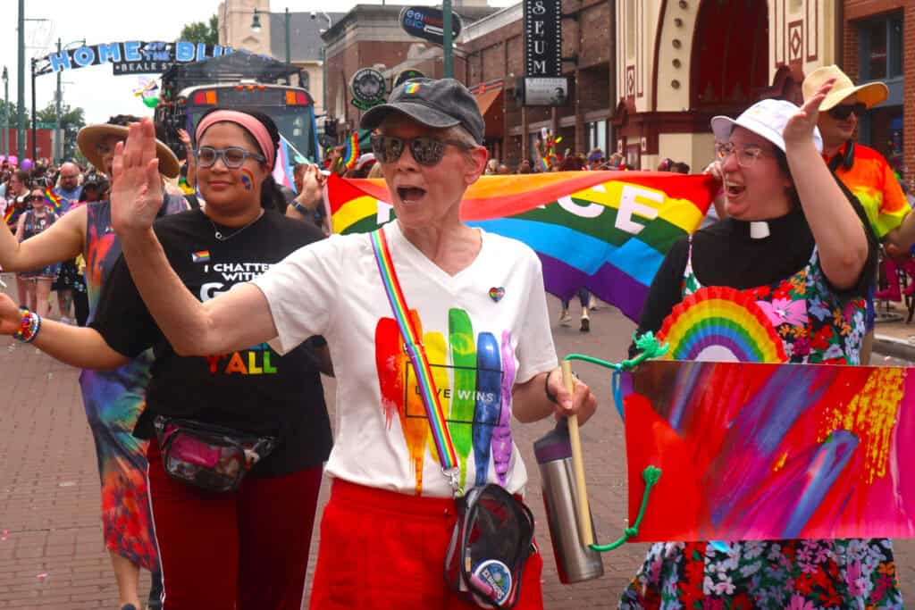 Performers in sequined gowns greet the crowd at Pride parade in Memphis. — focuslgbt.com