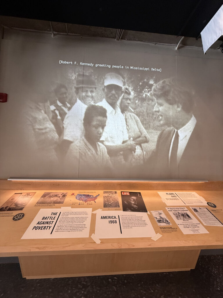 Black and white photo of Robert F. Kennedy greeting people in Mississippi Delta. — focuslgbt.com