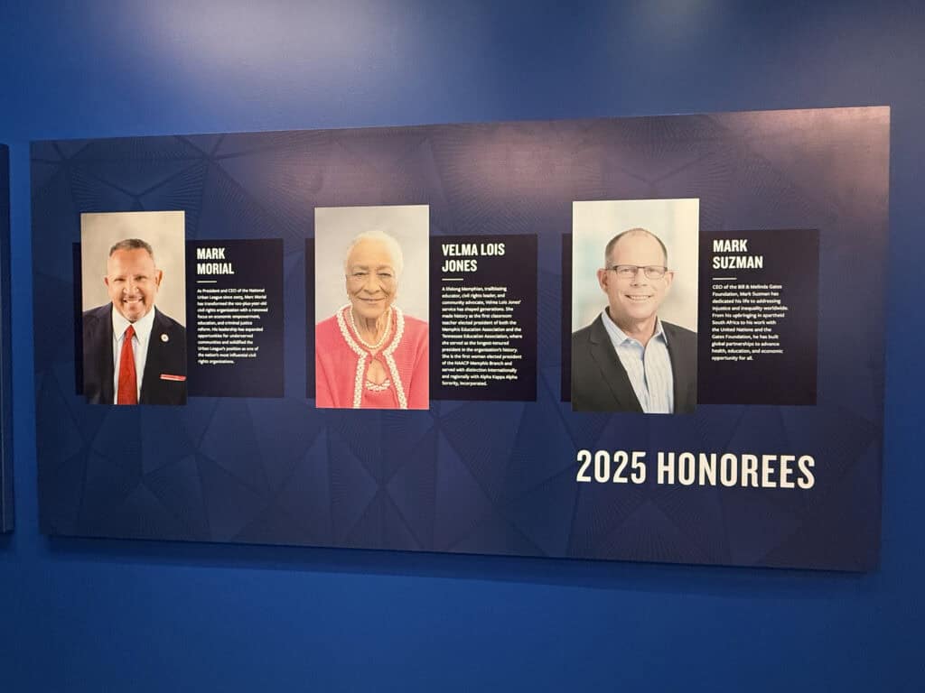 Three honoree portraits with names and descriptions on a blue wall. — focuslgbt.com