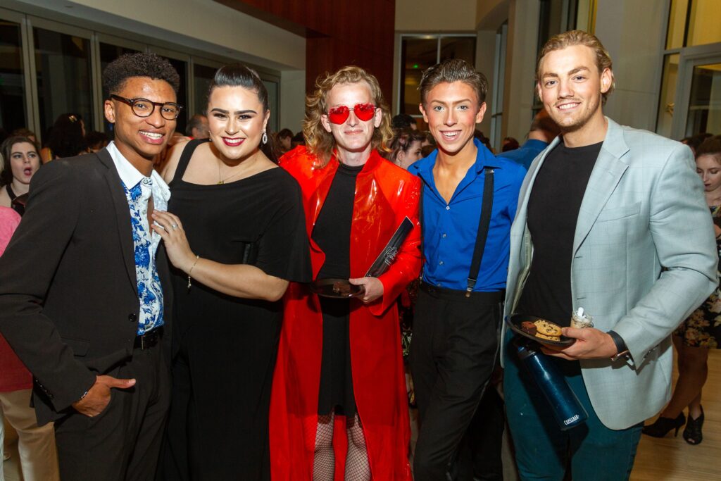Group of five people in formal attire at Memphis theatre event. — focuslgbt.com